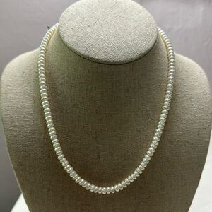 White cultured small pearl neckless 14k gold clasp 18 inches.